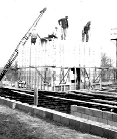 Construction workers building the First National Bank branch in Baltic