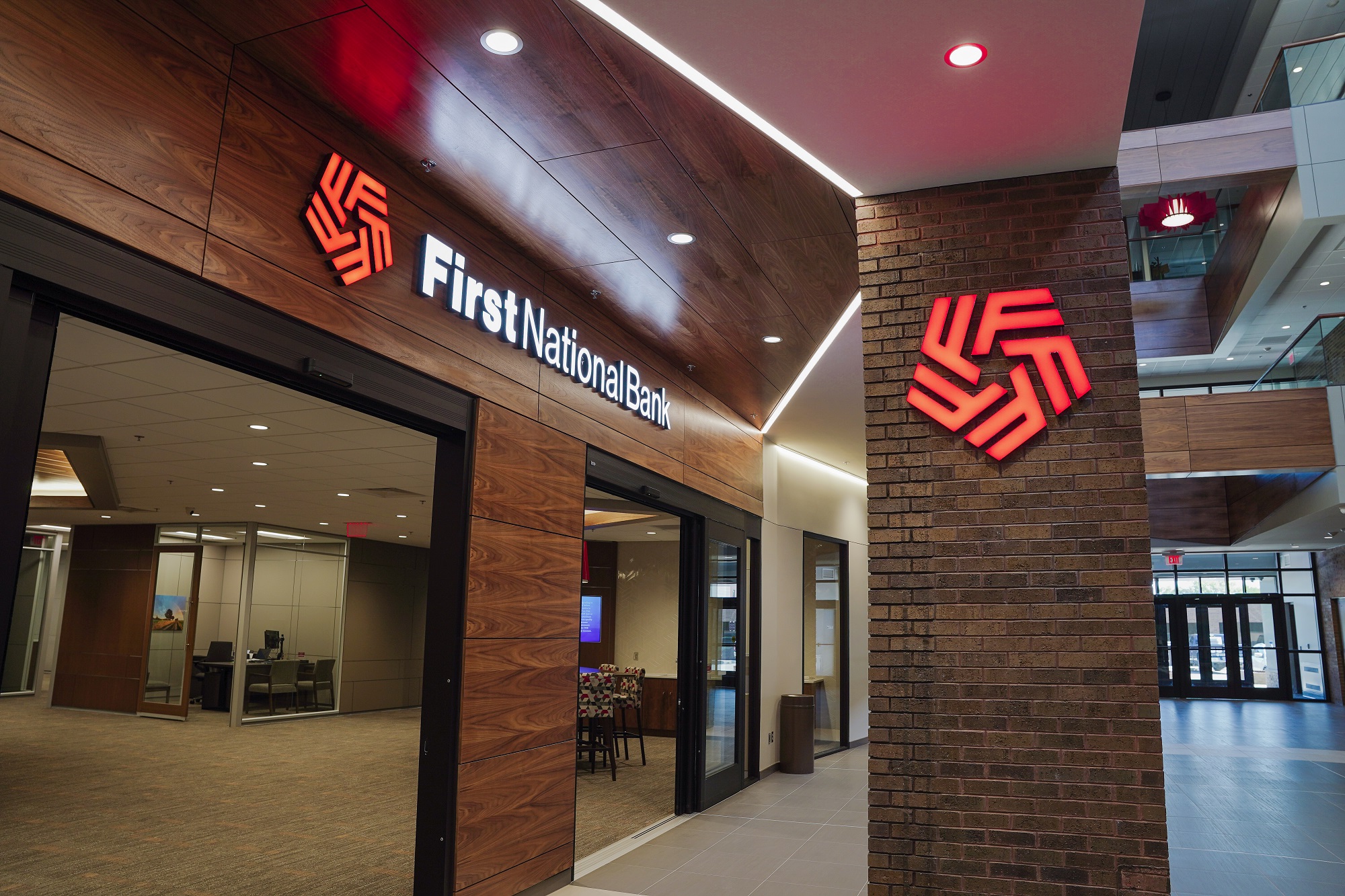 Lobby doors open to the newly renovated first floor of First National Bank.