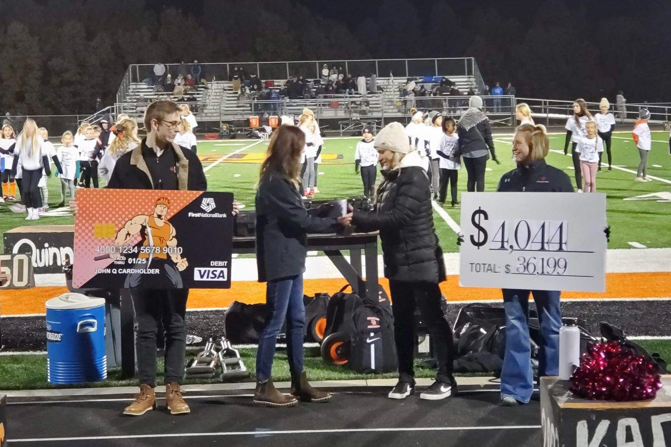 First National Bank distributing a Community Card check to Dell Rapids Public Schools.