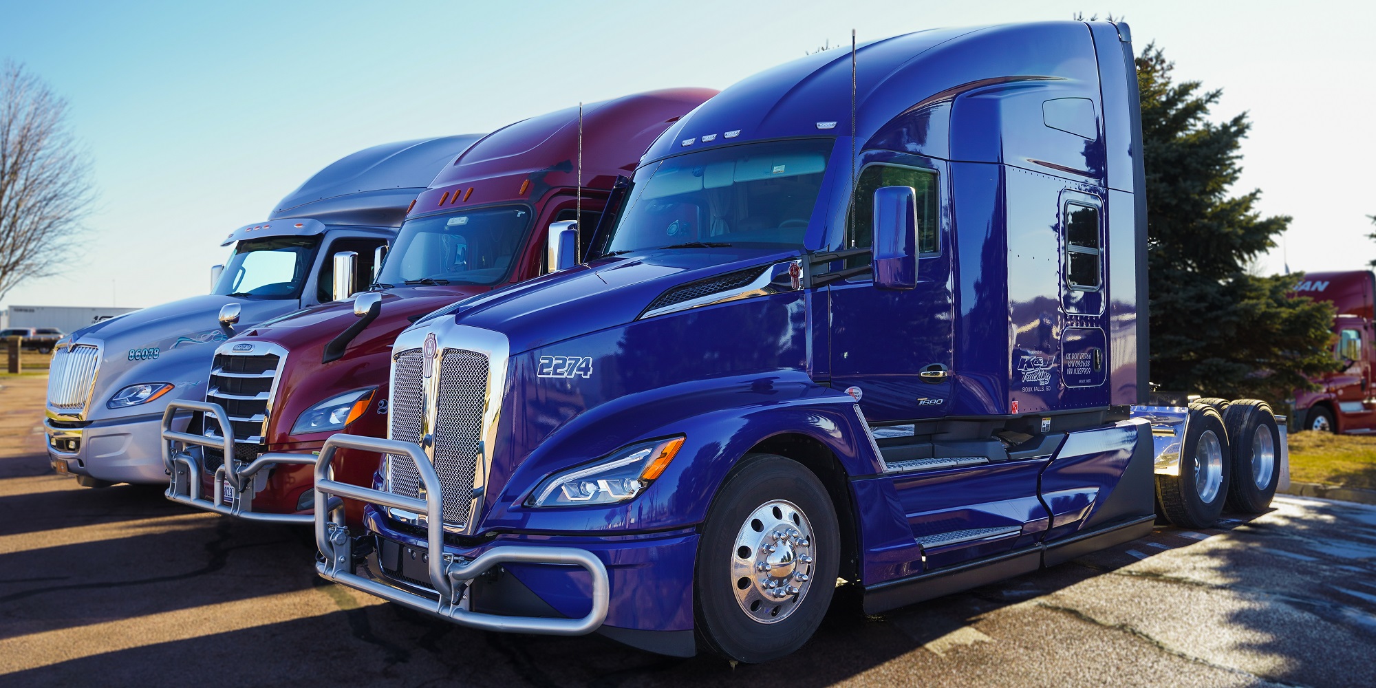 Trucks parked in the parking lot of First National Bank's Benson Road branch.