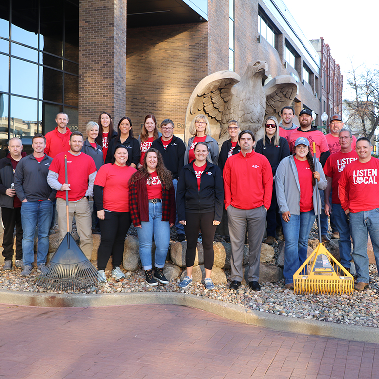 A large group of FNB teammates posing for a photo in downtown Sioux Falls.