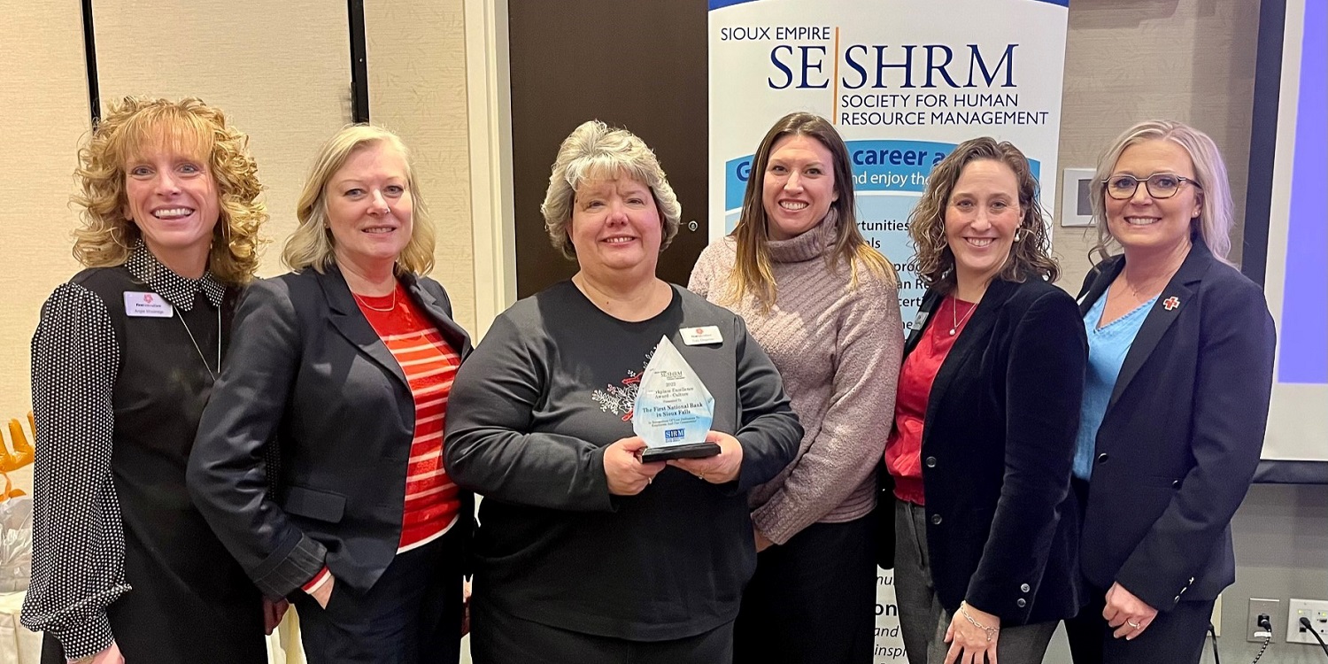 First National Bank teammates accept their 2022 Workplace Excellence Award for Culture from the Sioux Empire Society for Human Resource Management.