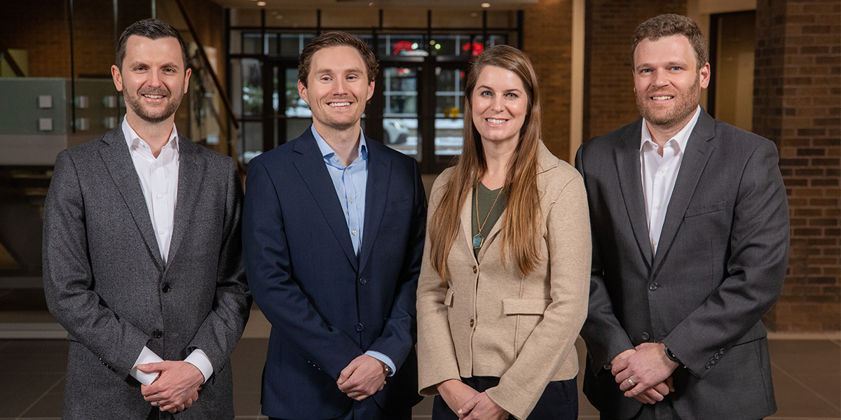 The First National Investments Team poses for a group picture in the FNB atrium.