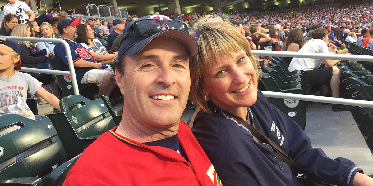 Julie Choudek and her husband at a Minnesota Twins baseball game.
