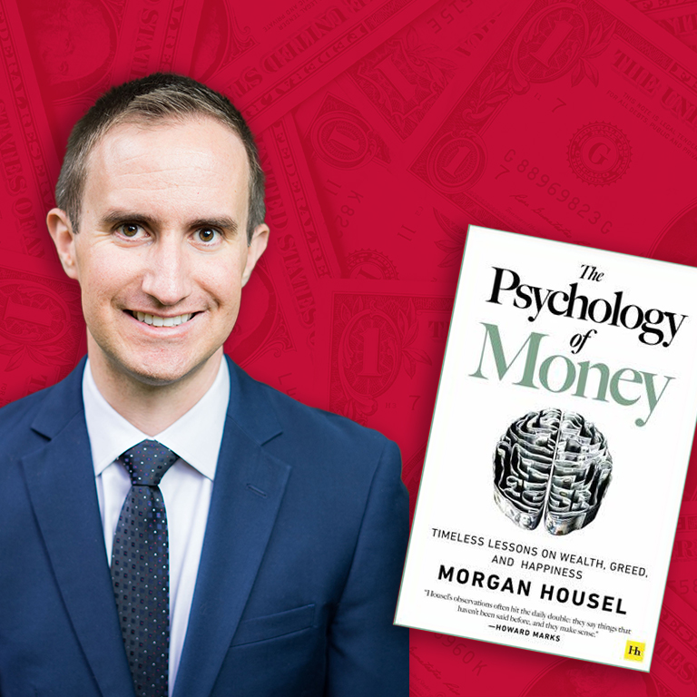 Morgan Housel with his book The Psychology of Money.