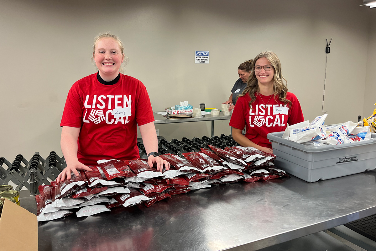 First National Bank interns sort packages at the Feeding South Dakota distribution center