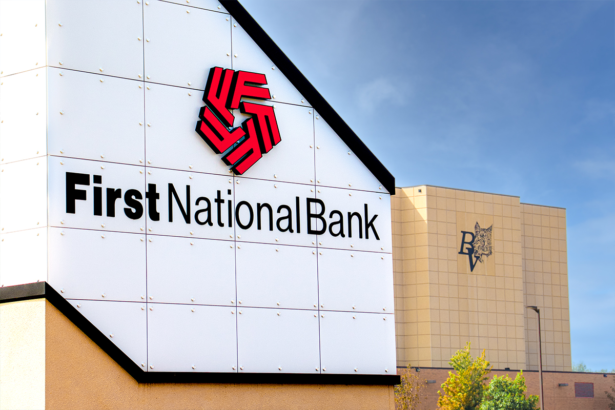 First National Bank's sign with Brandon Valley High School in the background.