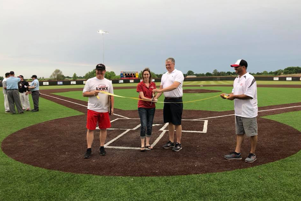 Bob Baker and Val Lemkau cut the ribbon on First National Bank Field in Brandon.