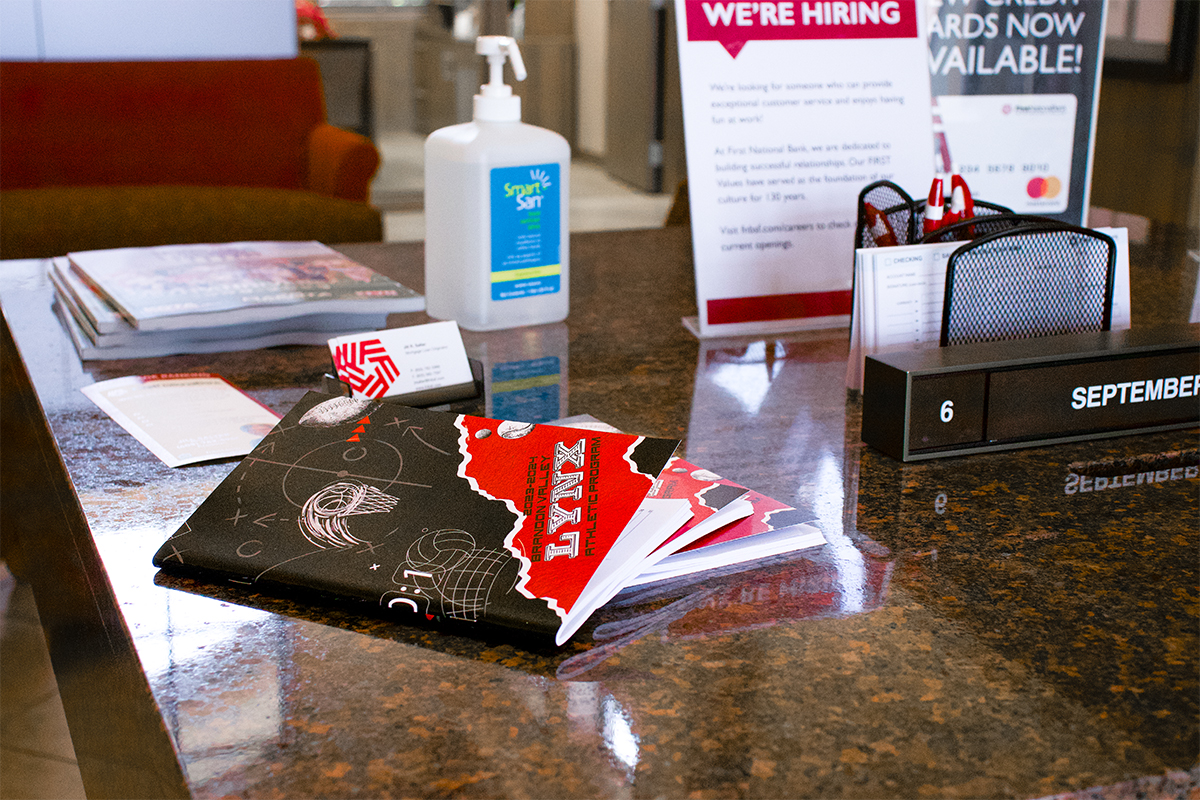 Lynx athletics booklets sit on the counter at First National Bank's Brandon branch.