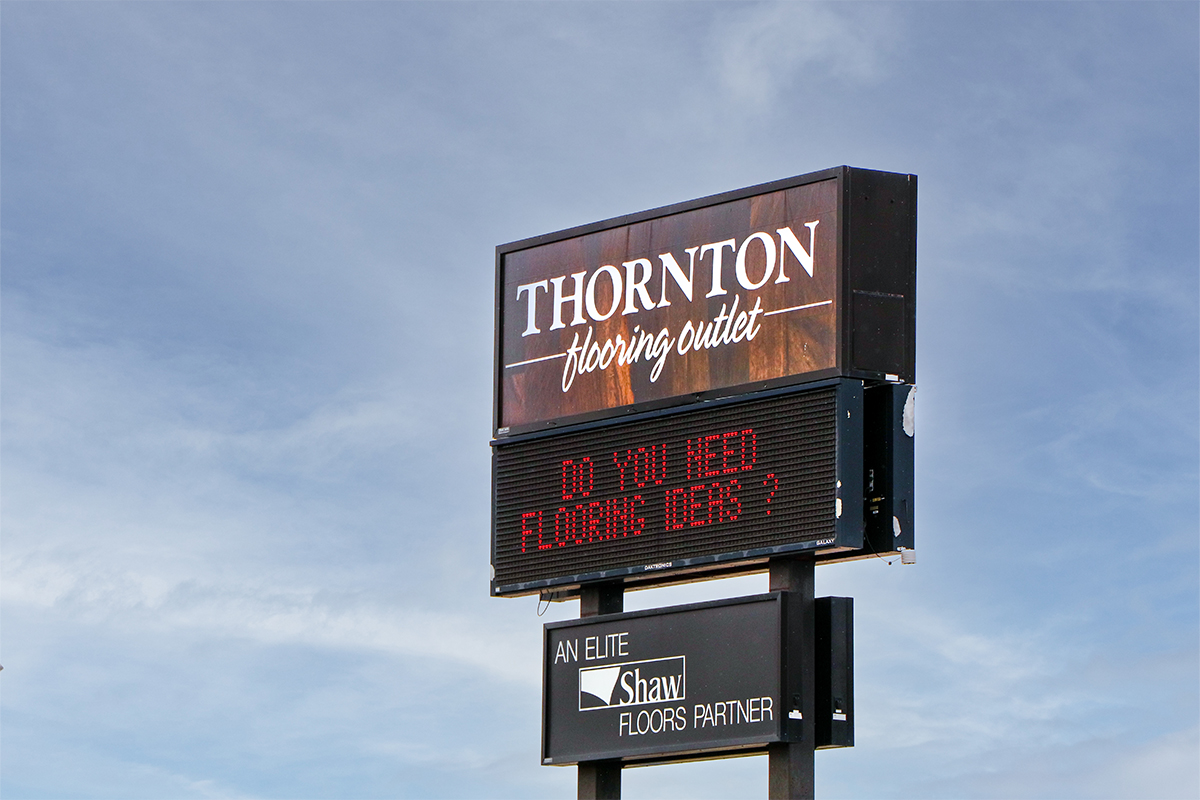 The Thornton Flooring sign located off the I-29 Tea exit in Sioux Falls, which reads "Do you need flooring ideas?"