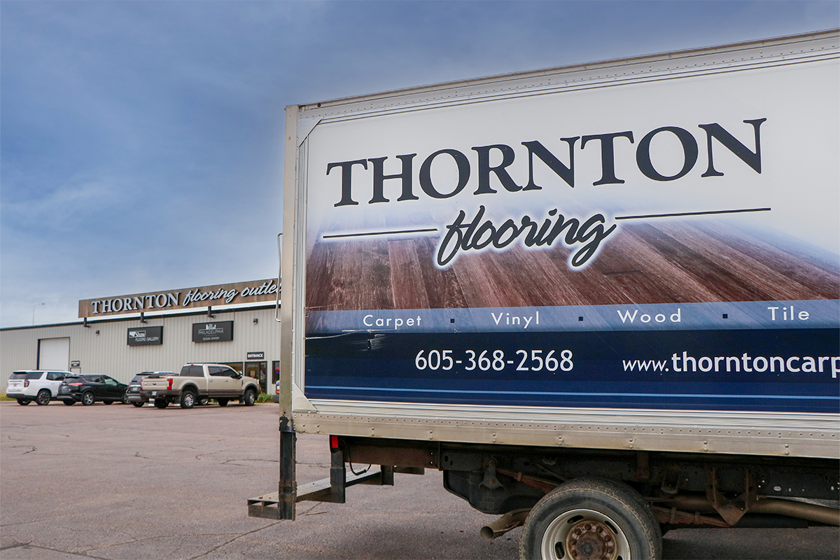 A Thornton Flooring delivery truck parked outside the business's Sioux Falls location.