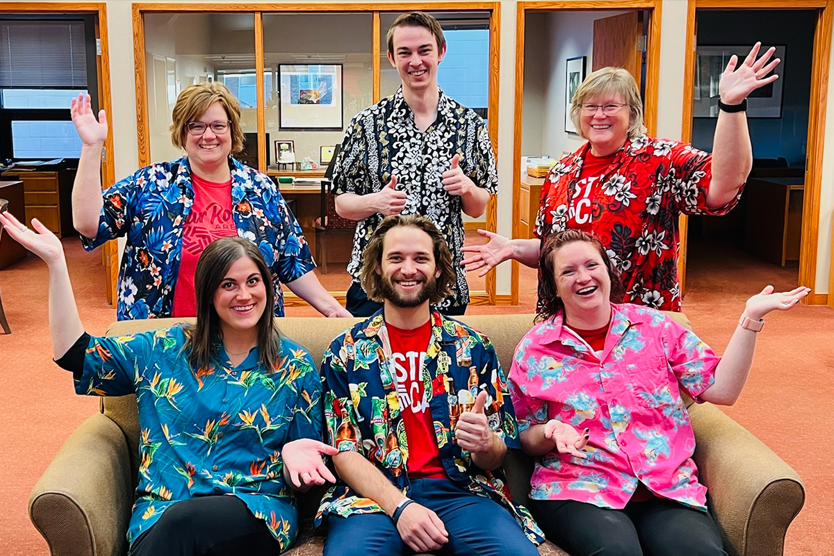 Employees of First National Bank's Dell Rapids branch wearing Hawaiian shirts for a theme day.