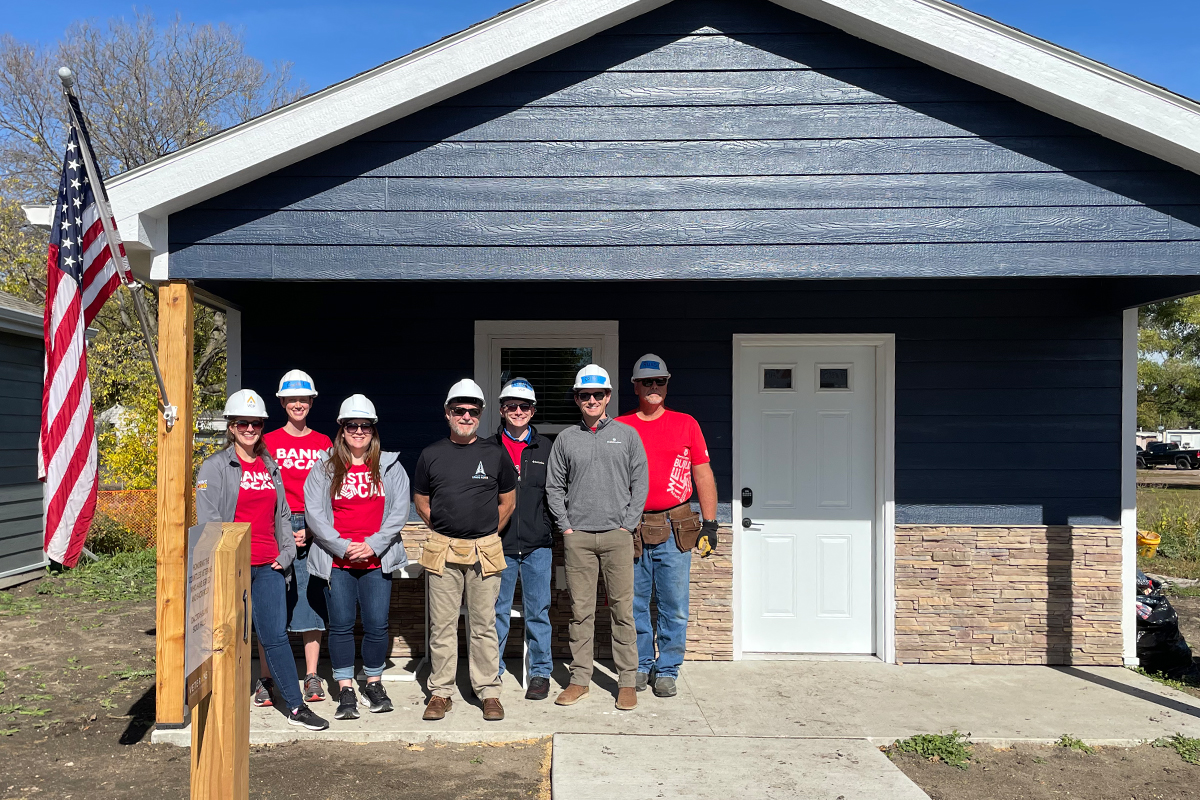 First National Bank employees visiting a home at the Veterans Community Project.