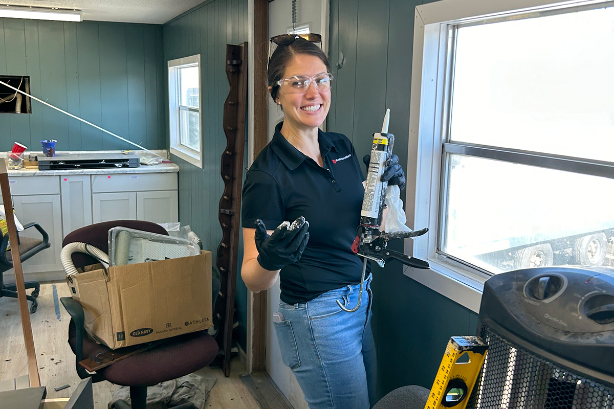 A First National Bank employee doing work on a home at the Veterans Community Project in Sioux Falls.