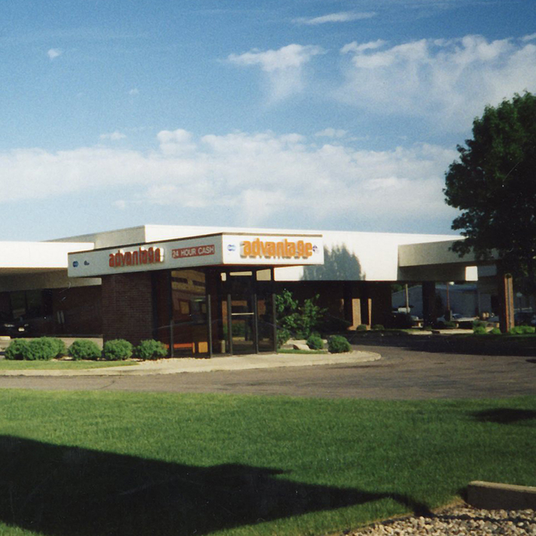 An old photo of an Advantage ATM outside a First National Bank branch.