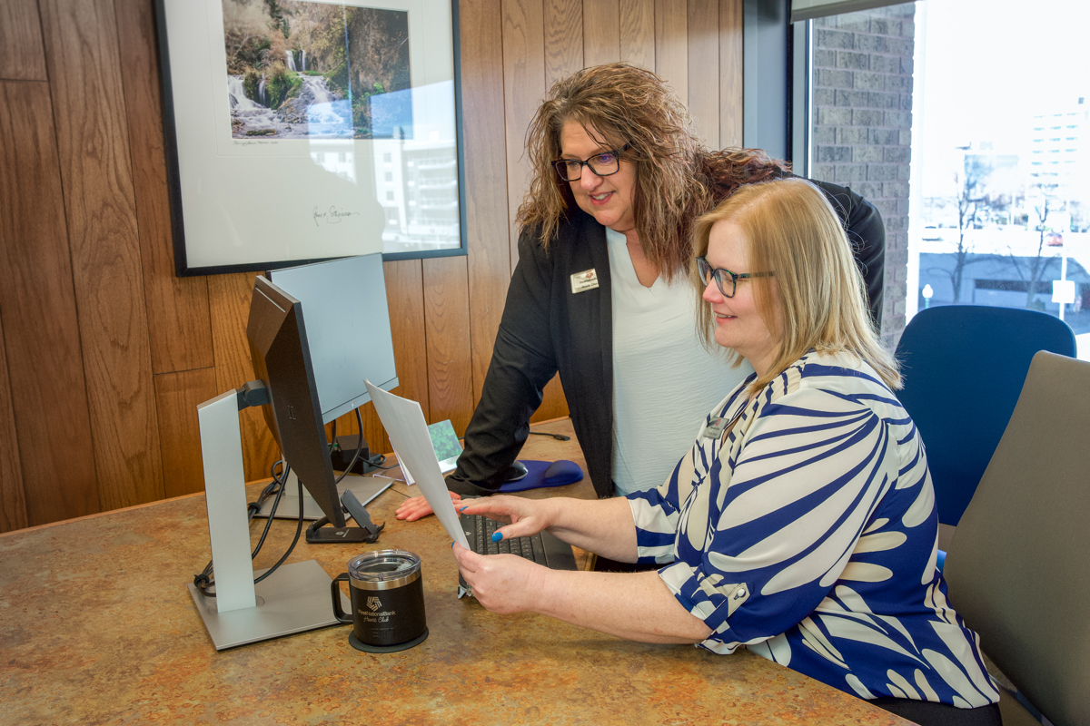 Roxie Olsen and Tammy Garcia look into a fraud case at First National Bank.