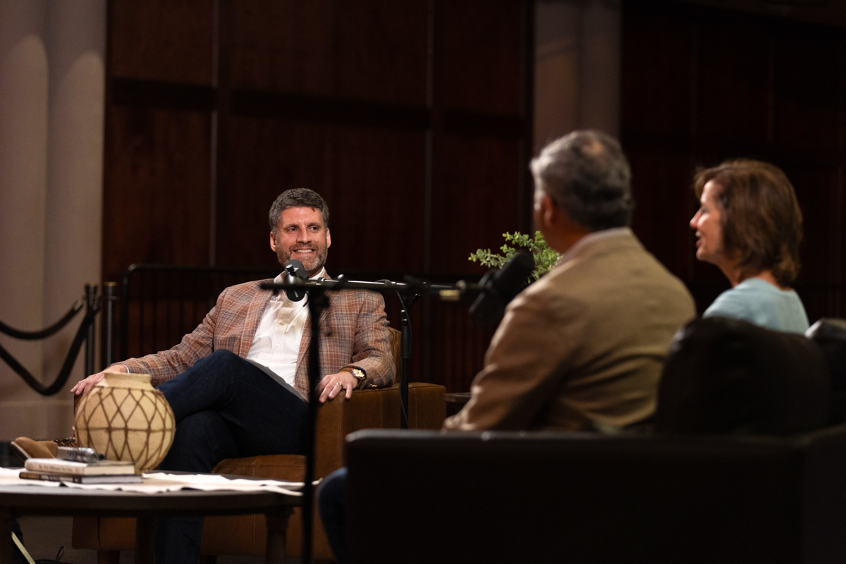 Adam Cox interviewing Michael and Jean Bender for an episode of Common Cents on the Prairie.
