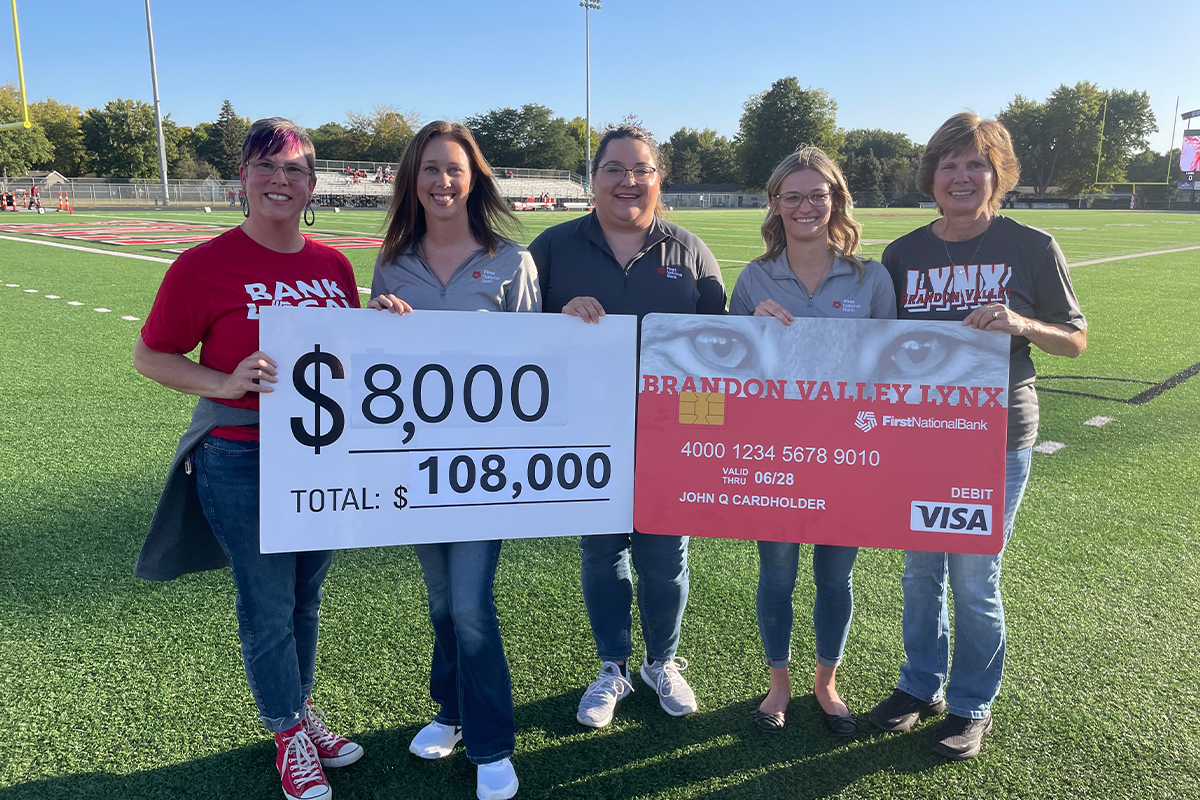 First National Bank presenting a Community Card check to the Brandon Valley School District.