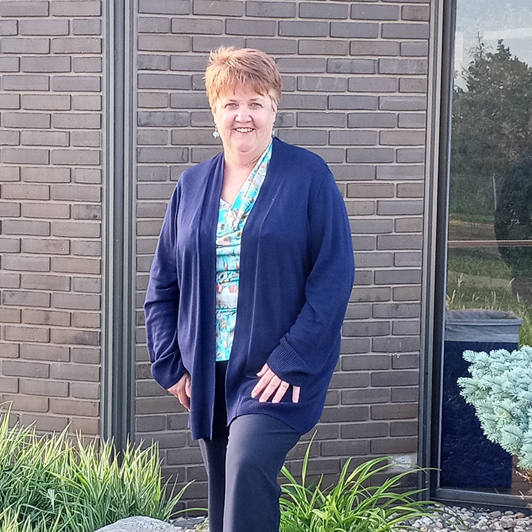 Karen Powell in front of an Advantage ATM.