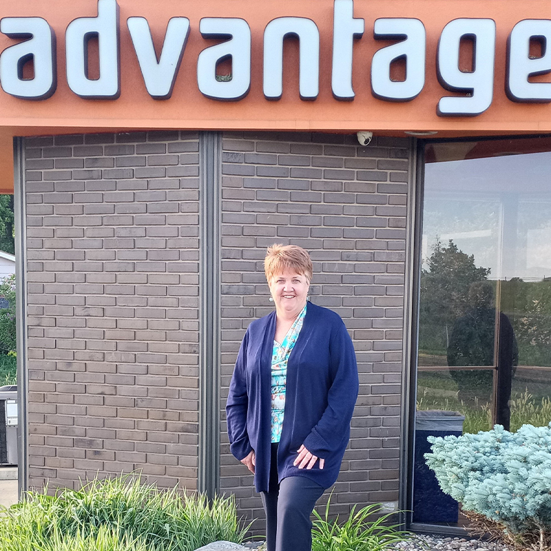 Karen Powell in front of an Advantage ATM.