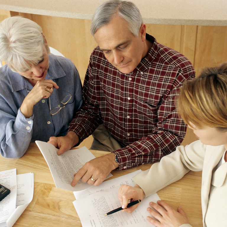 An older couple doing estate planning.