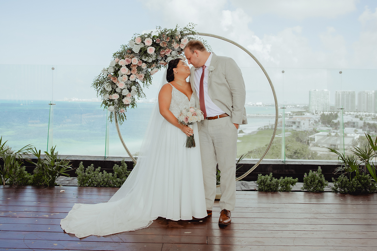 A young couple on the altar at their wedding.