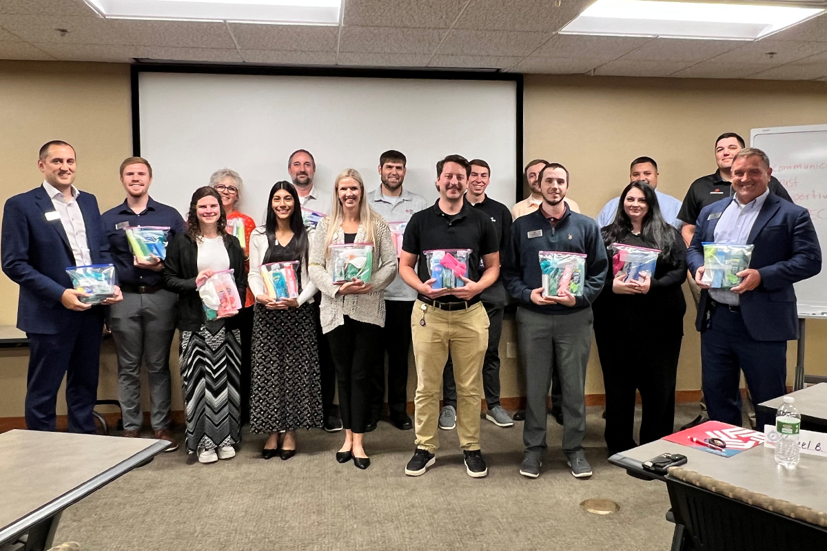 A group of people at First National Bank's new employee orientation.