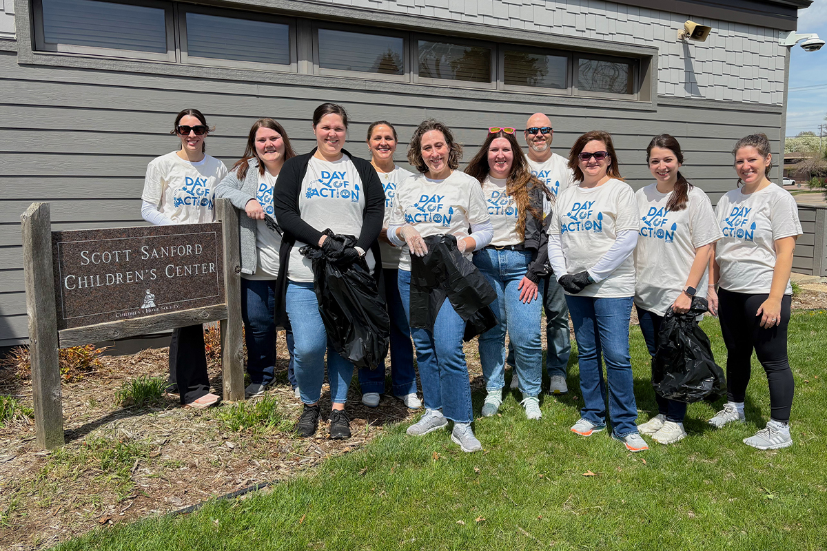 A group of people volunteering at the Children's Home Society in Sioux Falls.