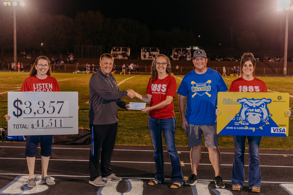 First National Bank presenting a check to the Baltic School District.