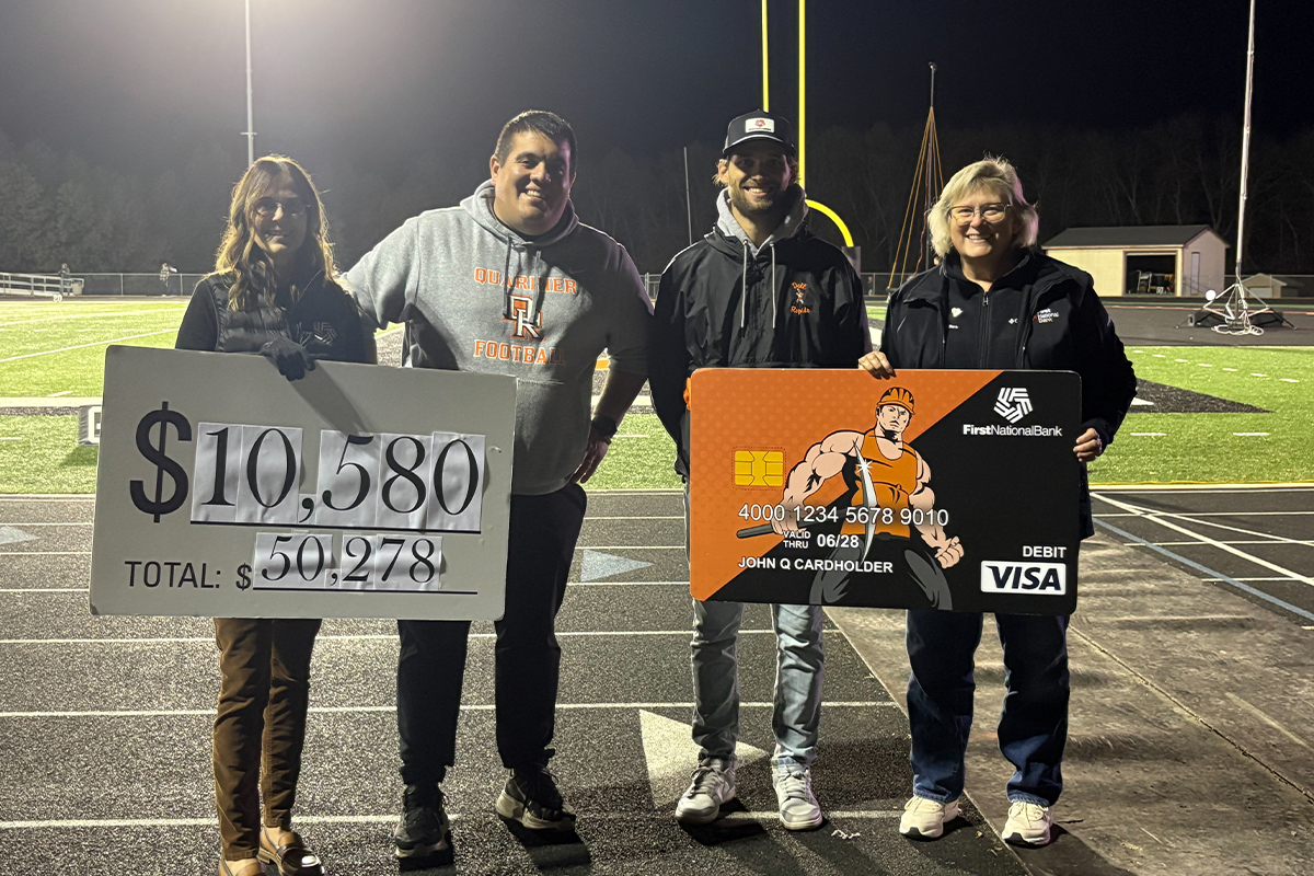 First National Bank presenting a check to the Dell Rapids School District.