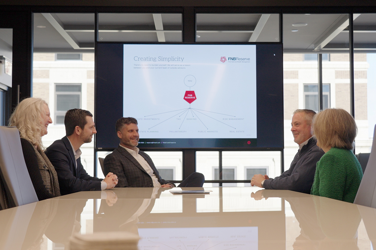 A client meeting at First National Wealth Management.