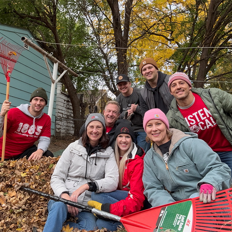 A group of people volunteering with Rake the Town in Sioux Falls.