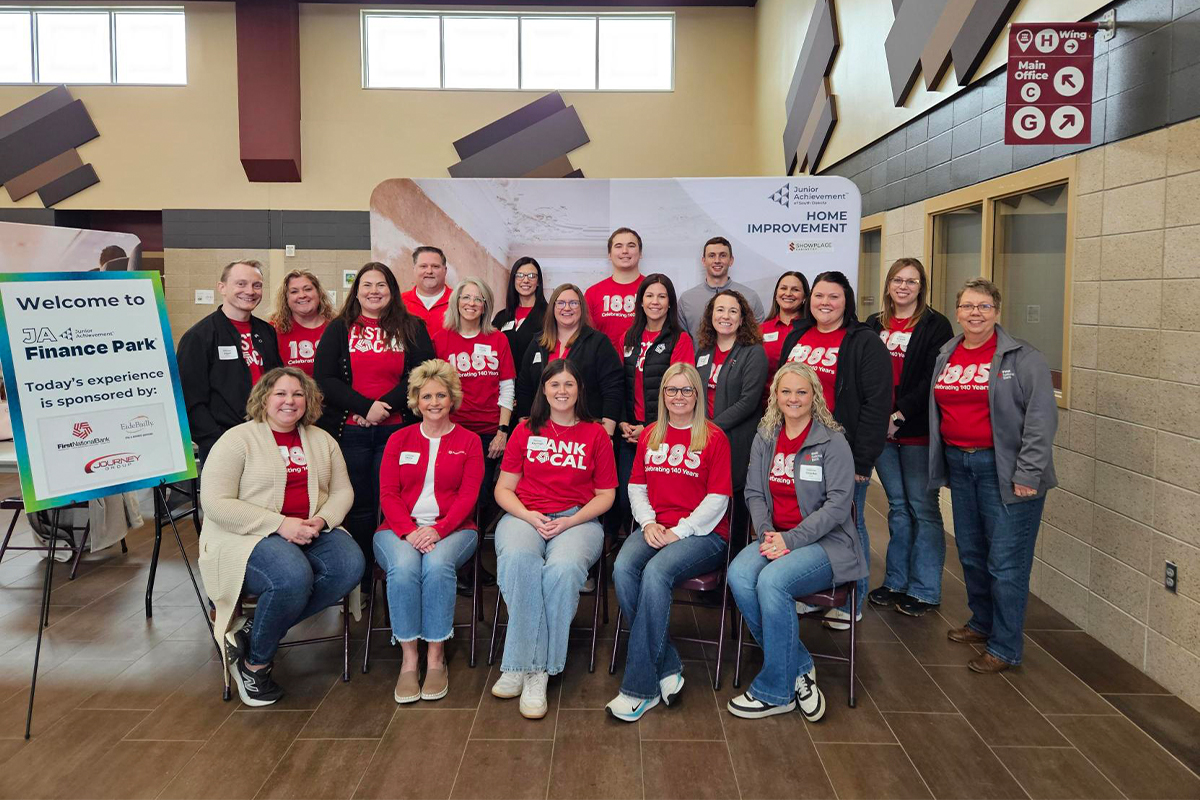 A group of people volunteering at Junior Achievement's Finance Park in Harrisburg.