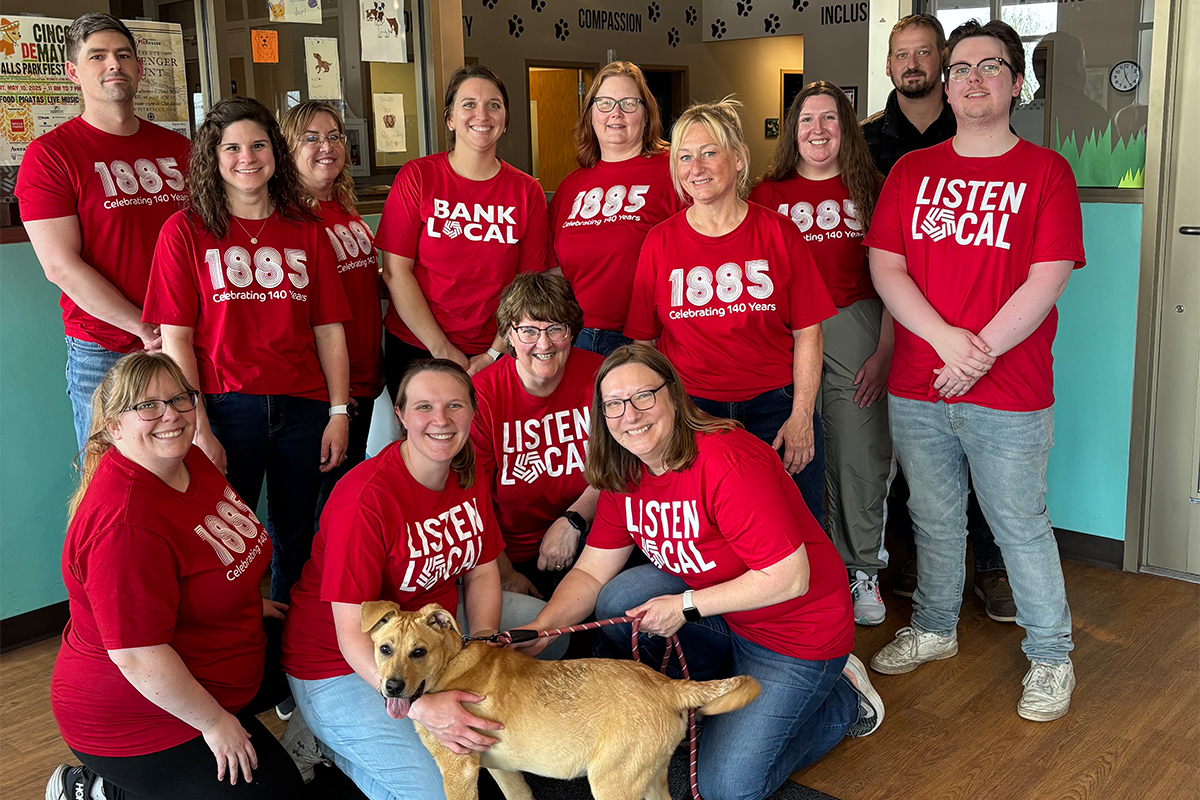 A group of people volunteering at the Sioux Falls Area Humane Society.