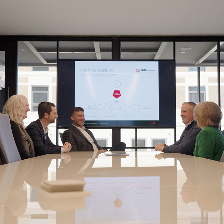 A client meeting at First National Wealth Management.