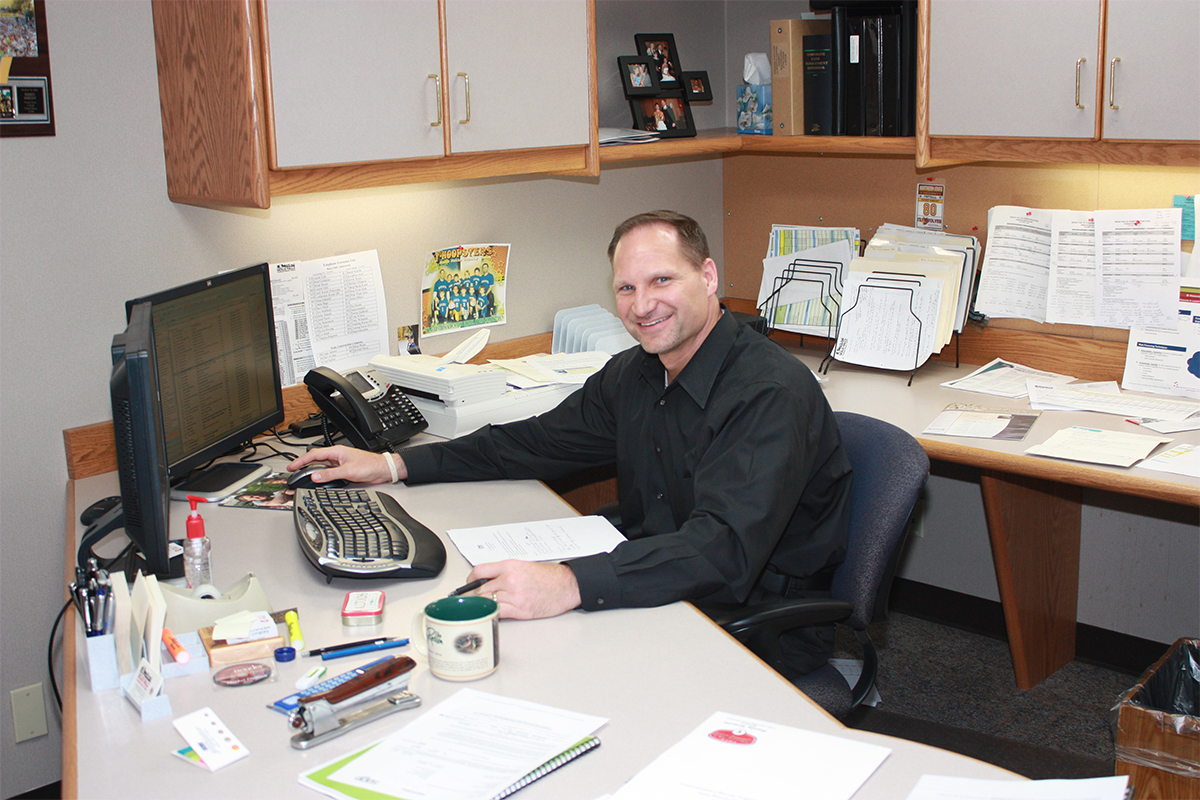 Former CEO Randy Knecht sitting at his office desk circa 2010.