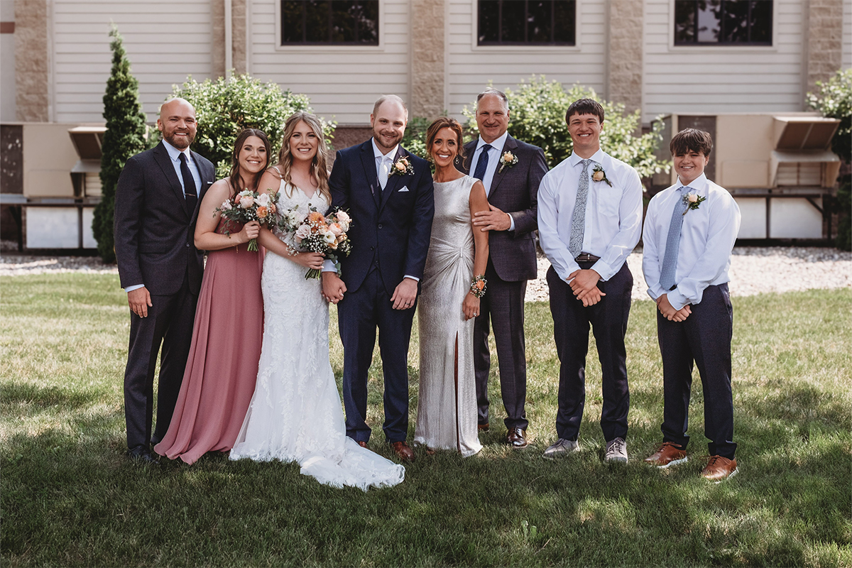 Randy Knecht's family posing for a photo at a wedding.