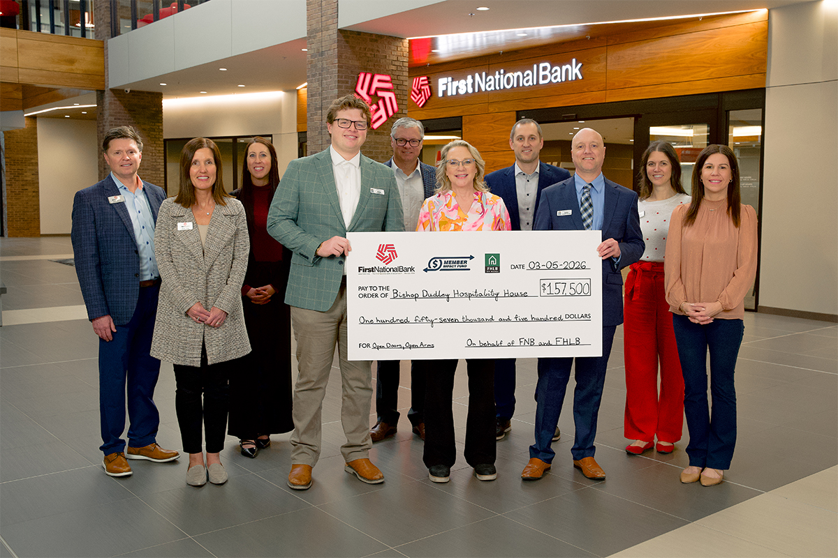 First National Bank presents a check to the Bishop Dudley Hospitality House.