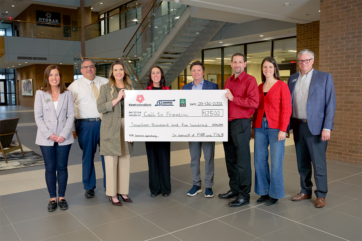 First National Bank presents a check to Call to Freedom.