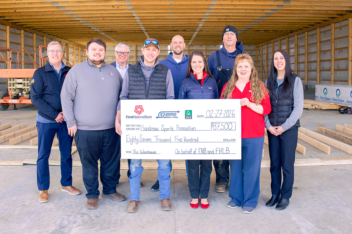First National Bank presents a Member Impact Fund check at The Warehouse in Flandreau.