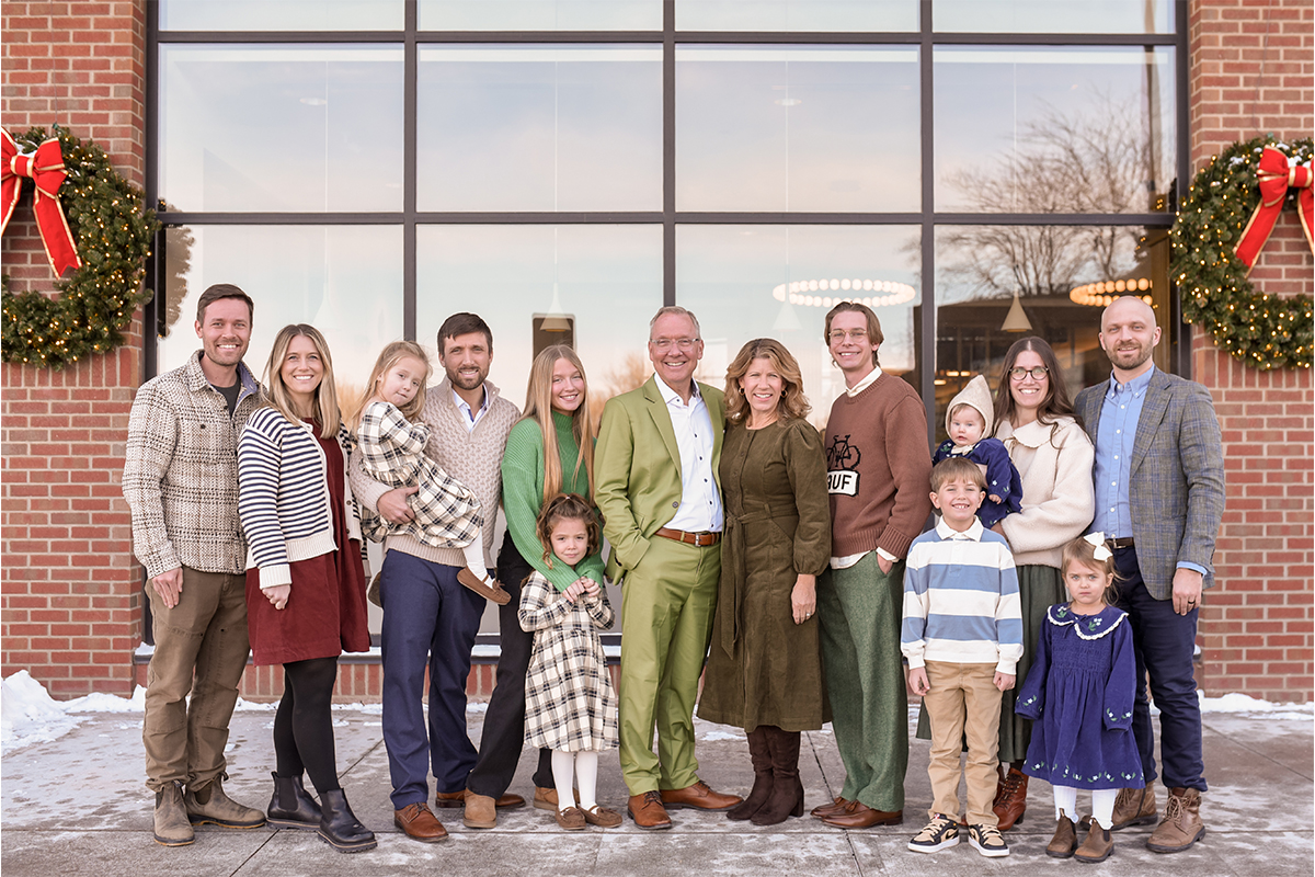 Family photo of Kristin and Craig Snyder with their kids and grandchildren.