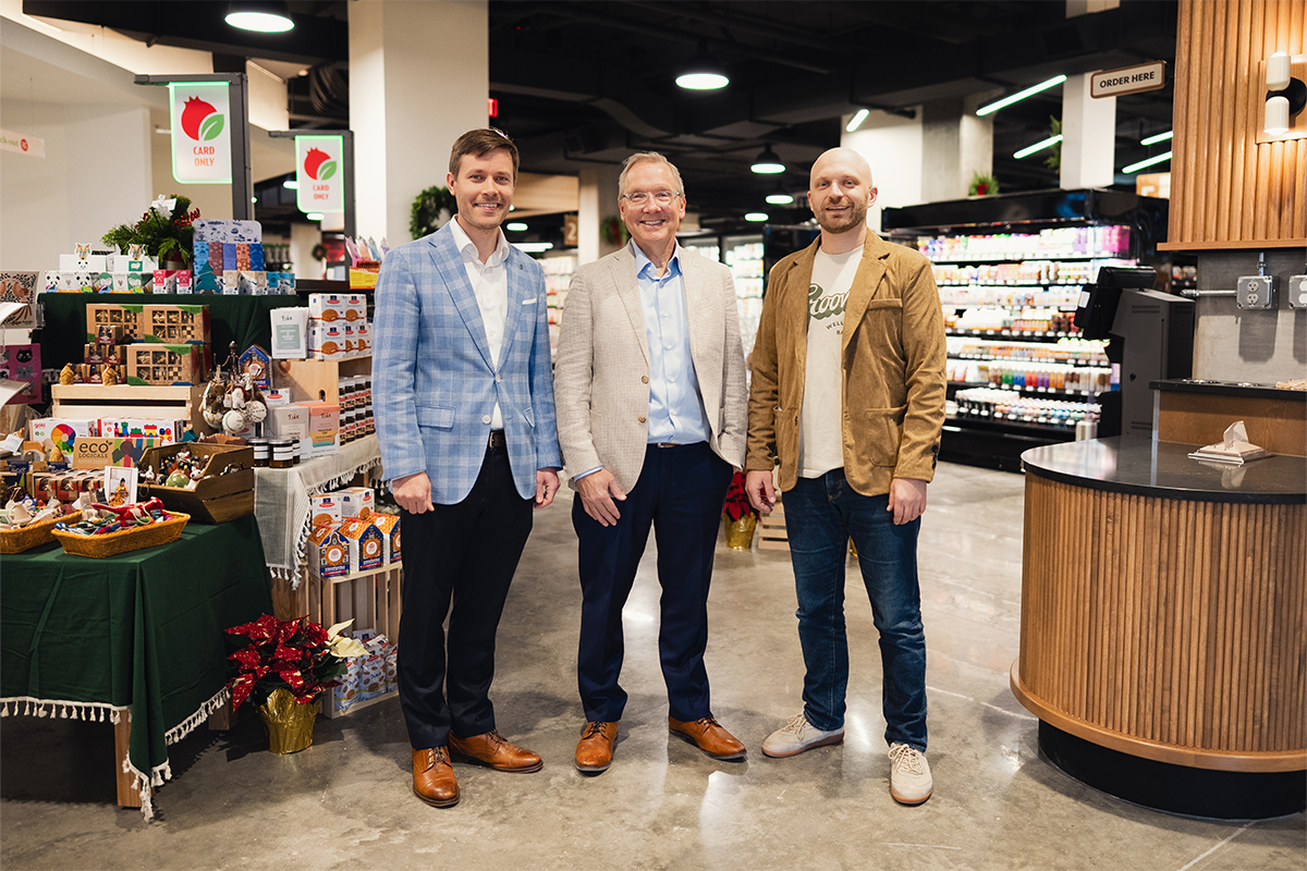 Jonah Snyder, Craig Snyder, and Gabe Messler standing in the new Pomegranate Market store.
