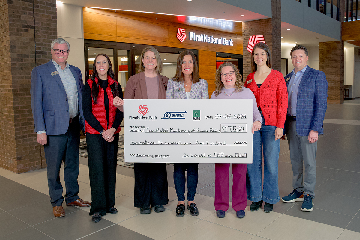 First National Bank presents a check to TeamMates Mentoring of Sioux Falls.