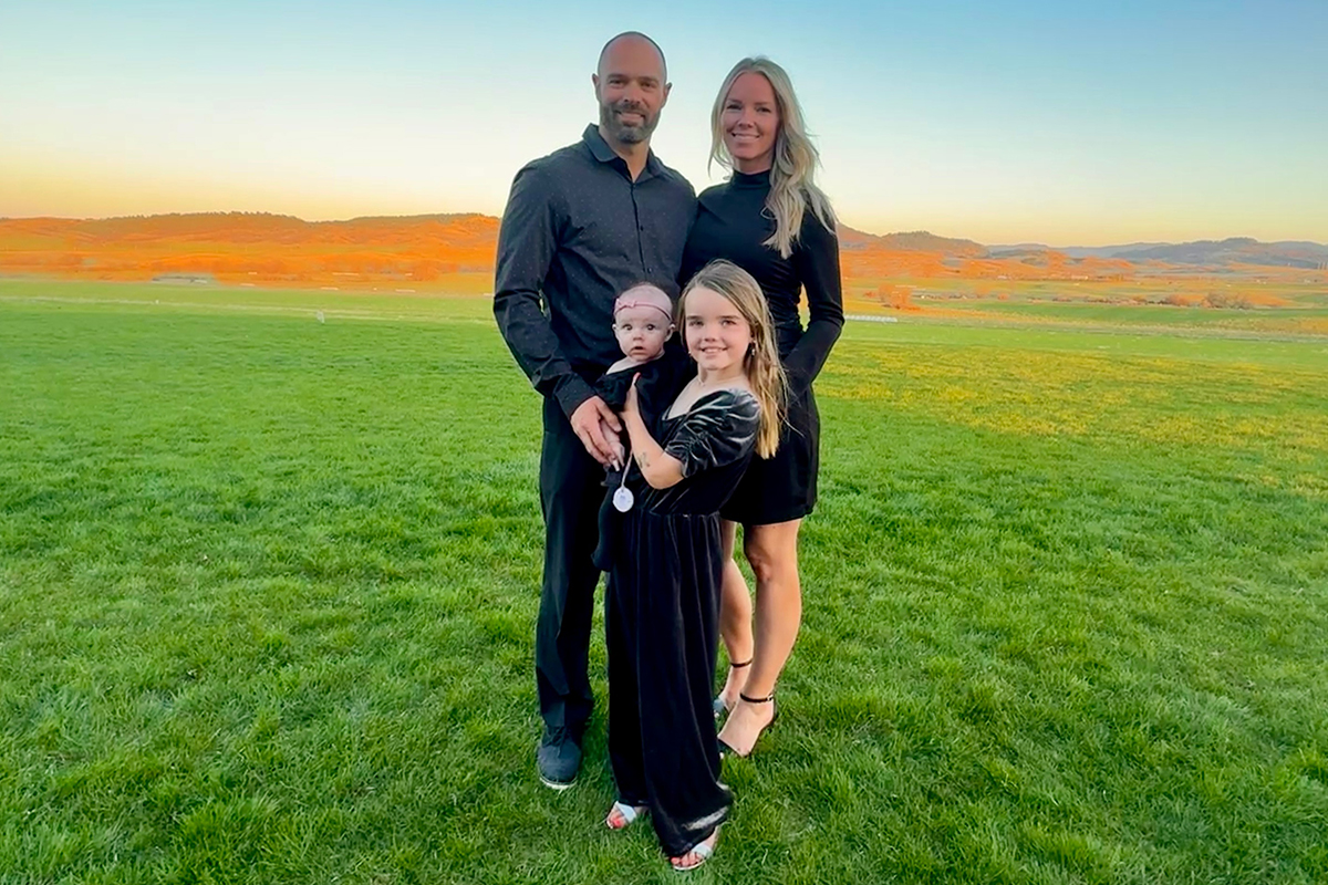 A family photo of Thomas Newman with his wife and two daughters.