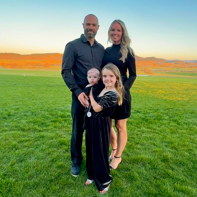 A family photo of Thomas Newman with his wife and two daughters.