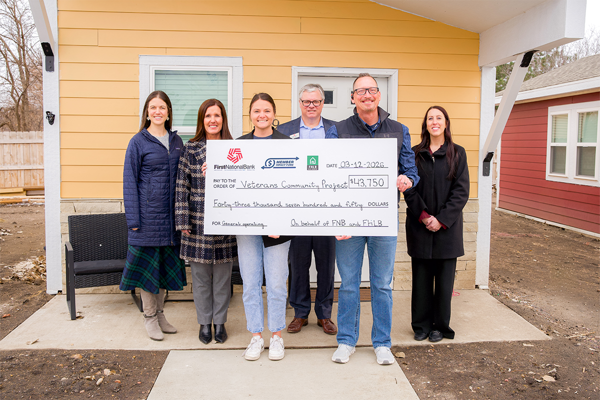 First National Bank presents a Member Impact Fund check at the Veterans Community Project of Sioux Falls.