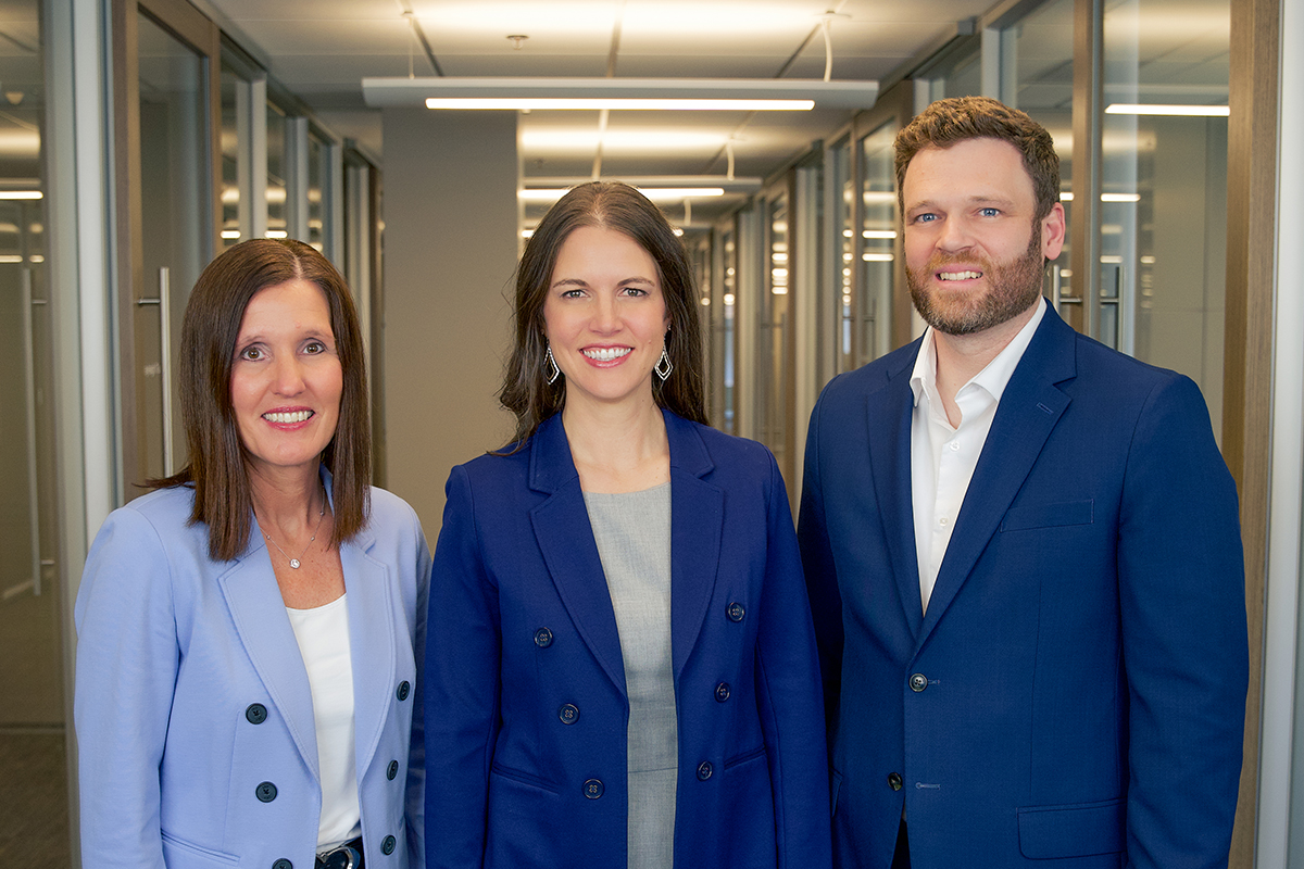 A professional photo of Sarah Hogg, Maggie Groteluschen, and Matt Adamson.