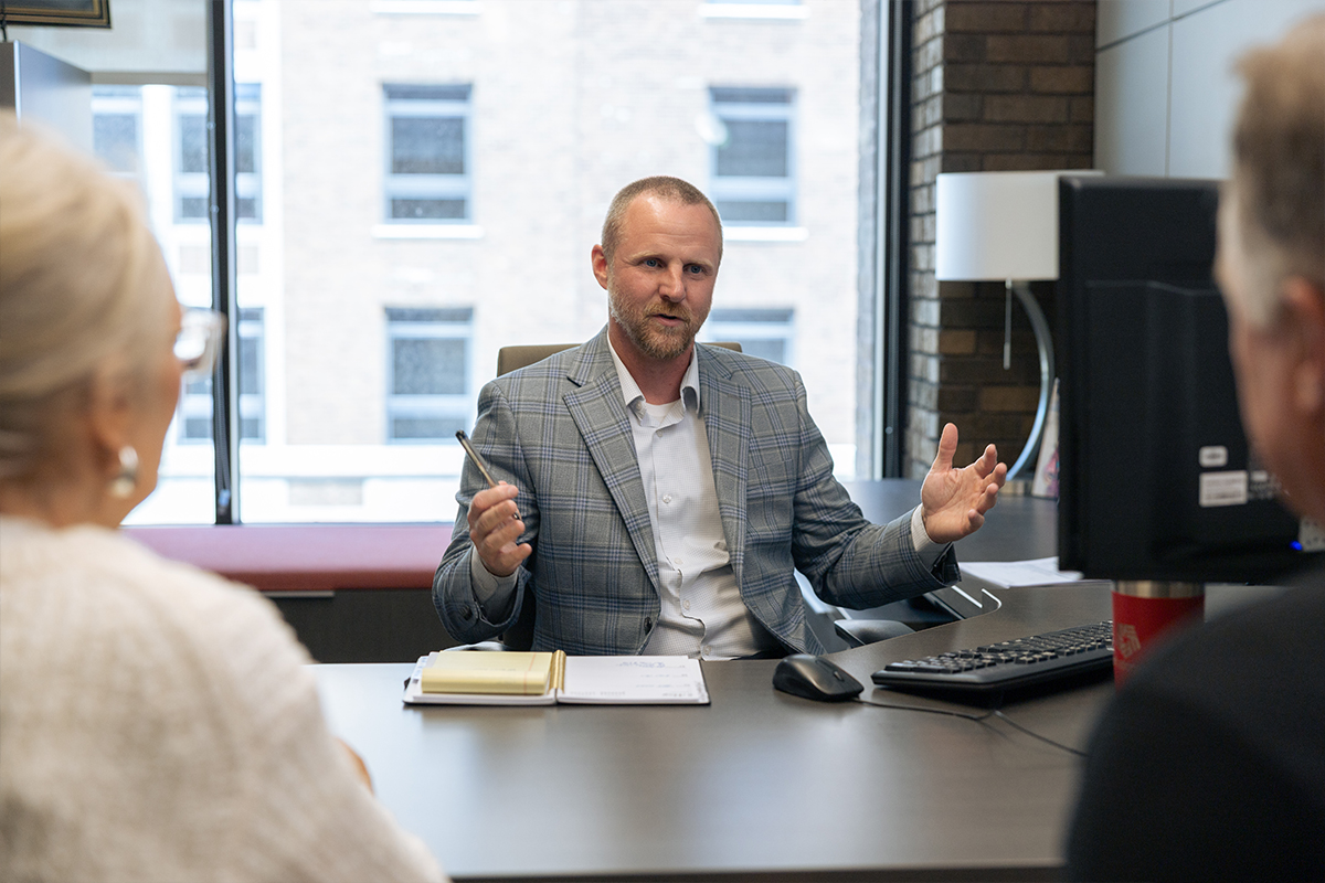 Wealth Advisory Manager Bryant Henderson meeting with clients.