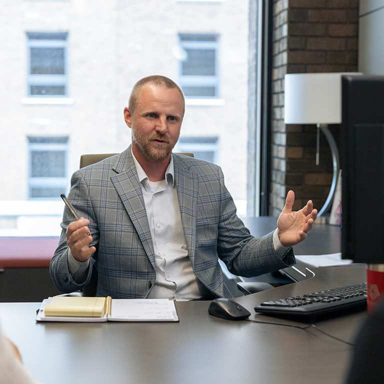 Wealth Advisory Manager Bryant Henderson meeting with clients.