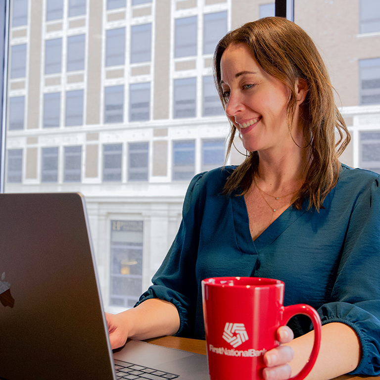 Woman looking at laptop